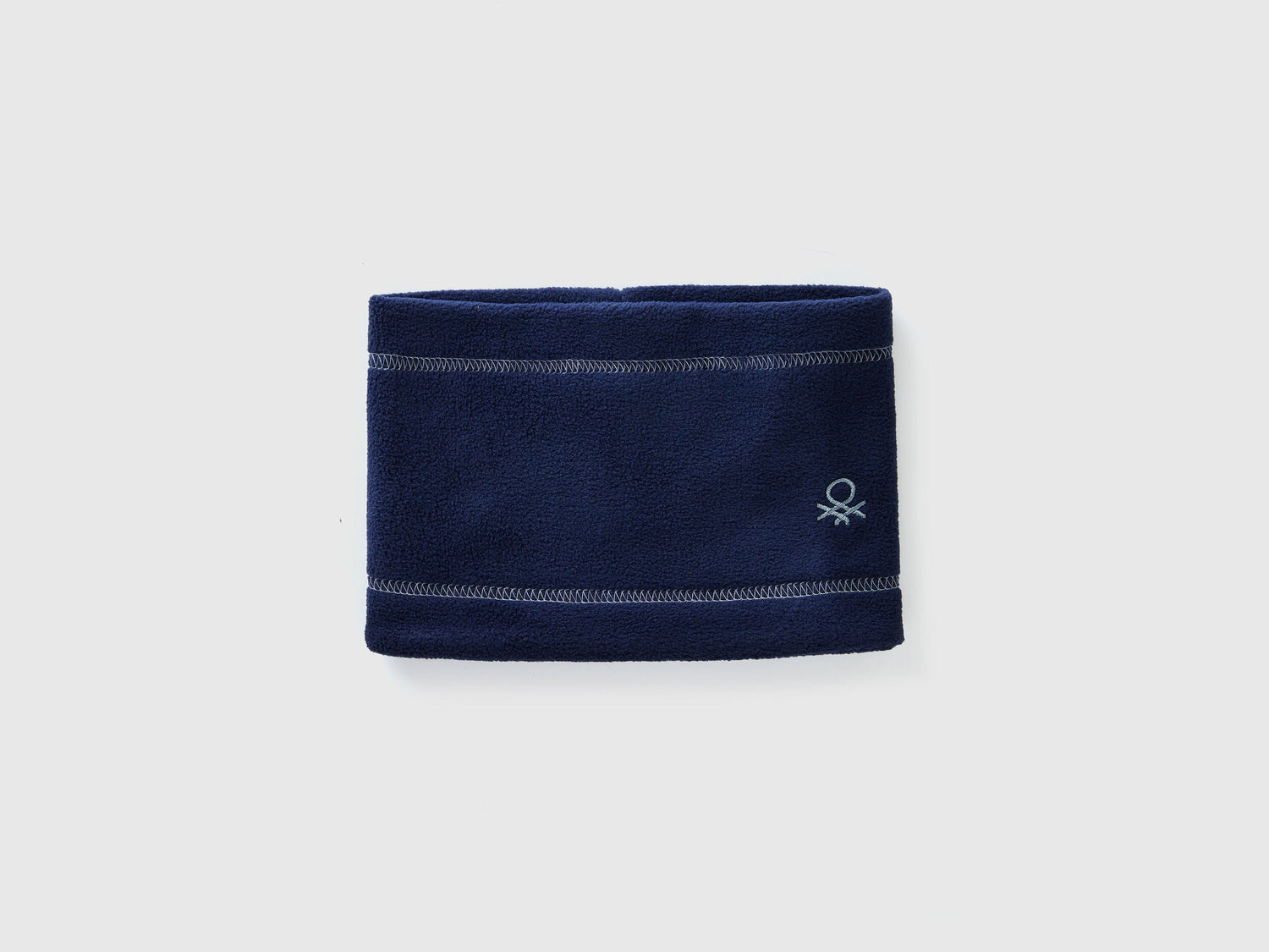 Navy blue fleece neck warmer, folded flat, soft and warm.
