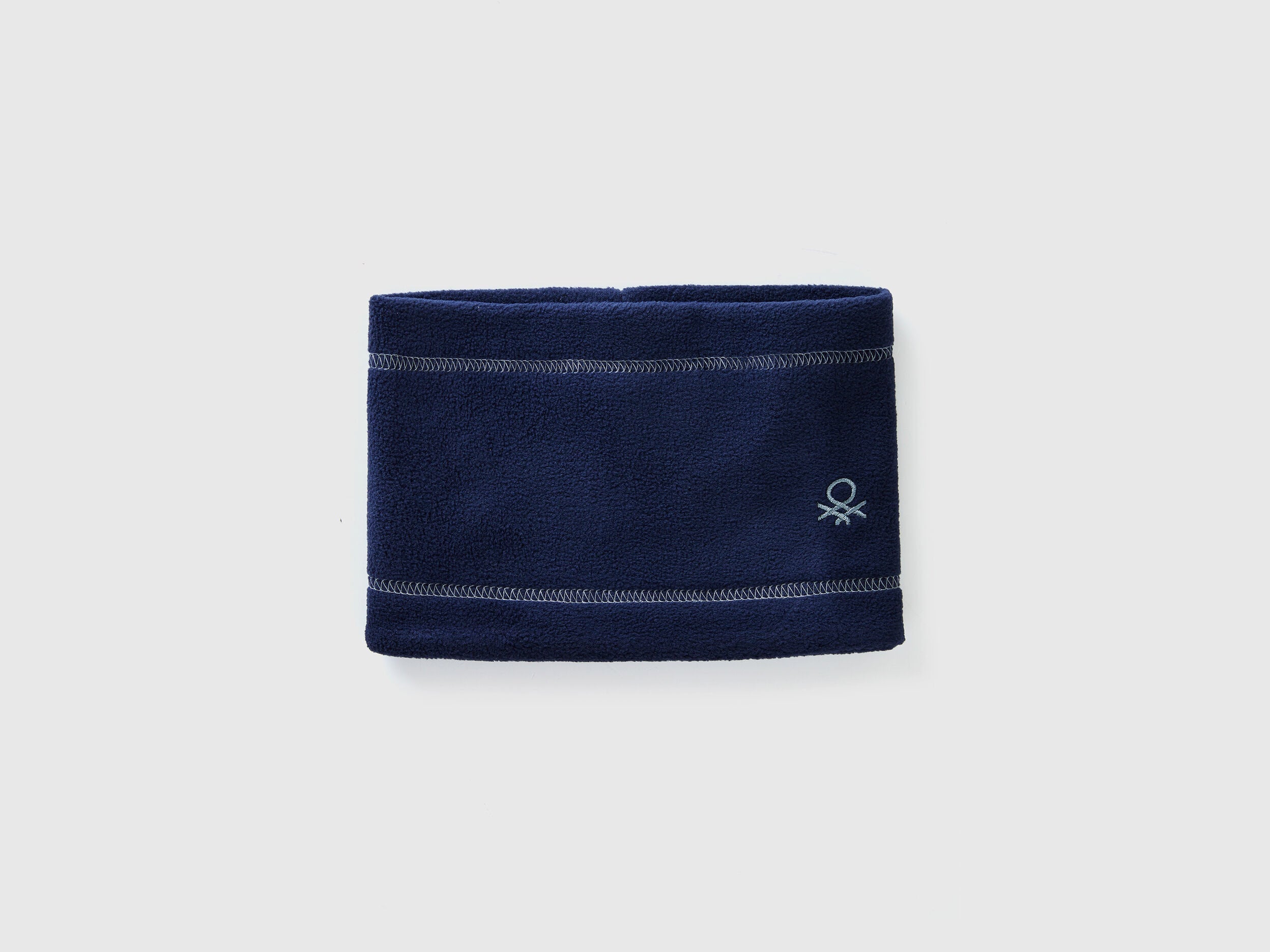 Navy blue fleece neck warmer, folded flat, soft and warm.