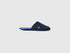 Single navy blue slipper with a green logo on the side.