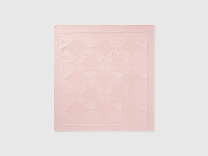 Front view of a light pink Benetton knit baby blanket with subtle texture. Soft and warm.