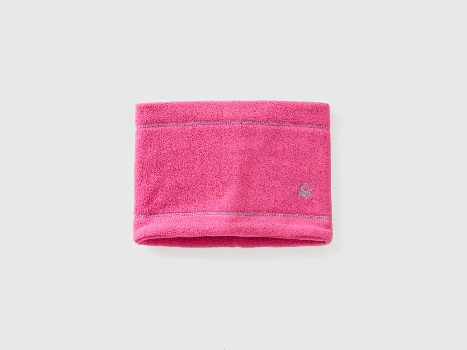 Pink fleece neck warmer, folded flat, warm and soft.