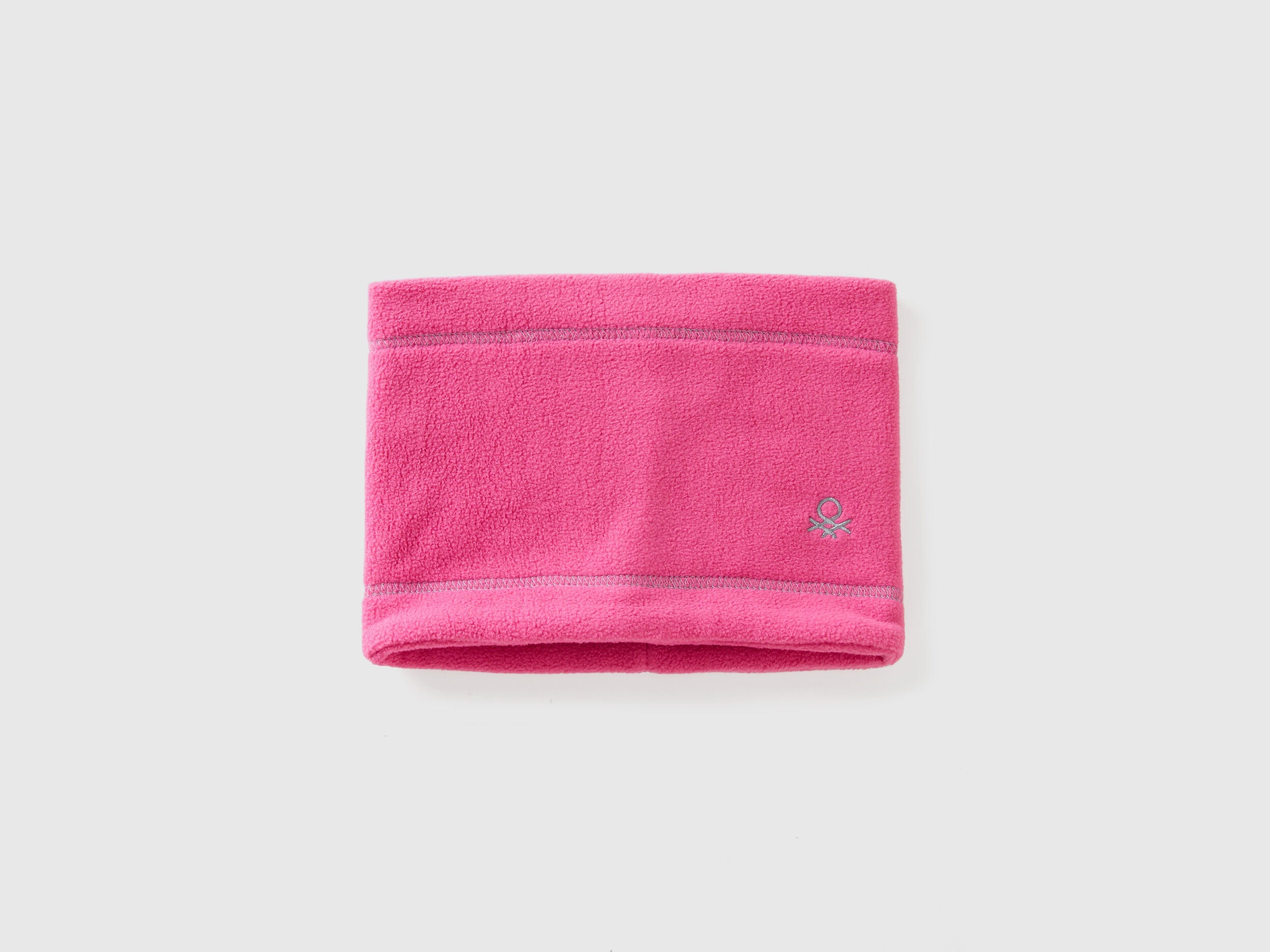 Pink fleece neck warmer, folded flat, warm and soft.