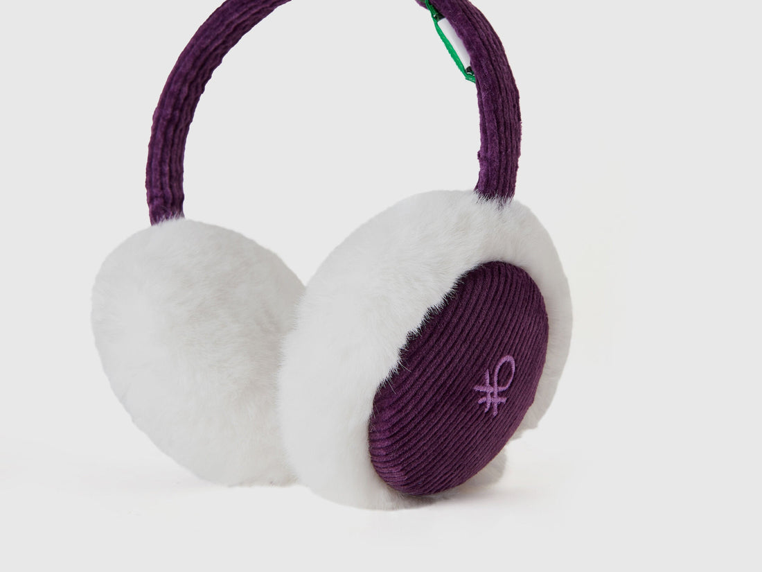 Close-up of purple and white earmuffs with Benetton logo.