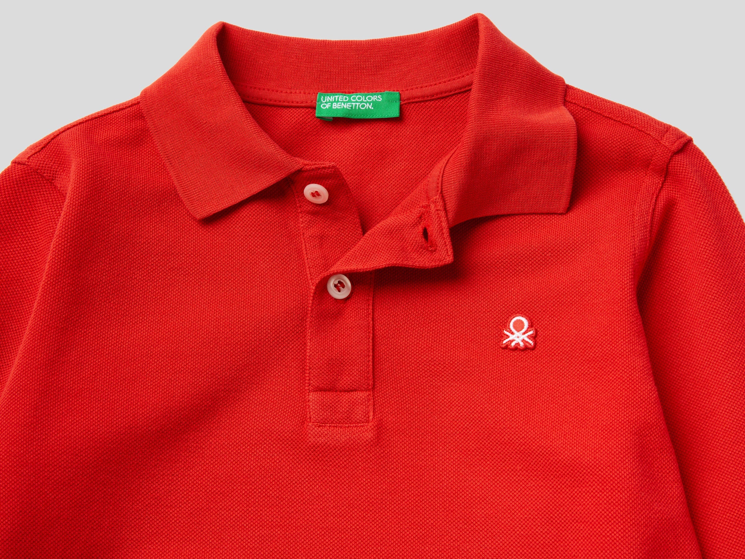 Close-up detail of a red long-sleeve kids&
