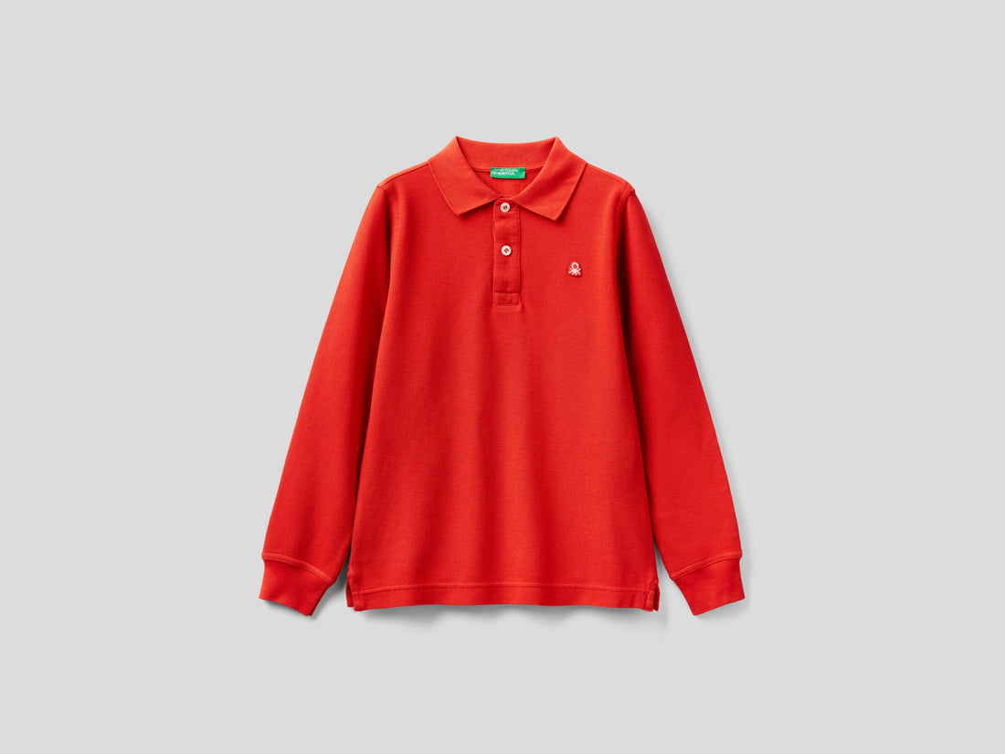 Front view of a vibrant red long-sleeve polo shirt for kids, featuring a classic collar and two-button placket.