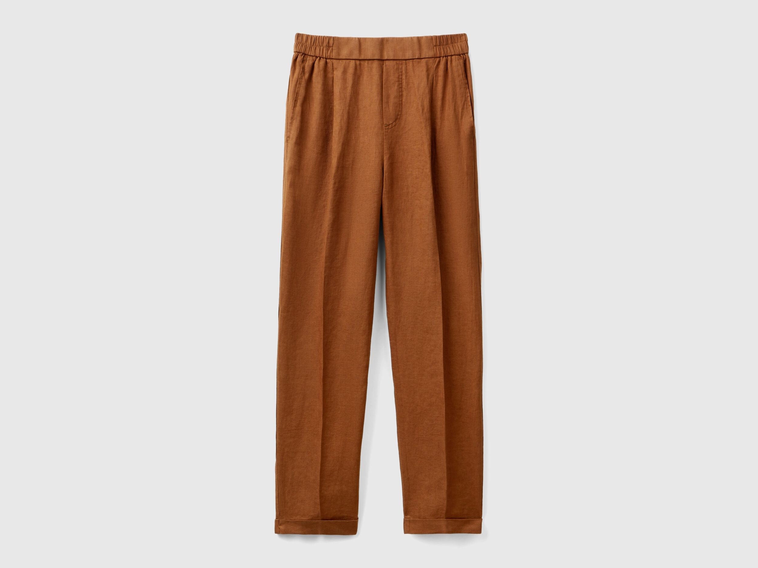 A female model wearing a pair of  reddish-brown women&