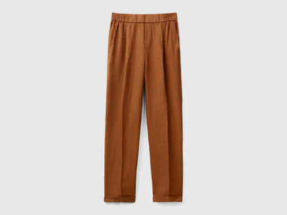 A female model wearing a pair of  reddish-brown women&