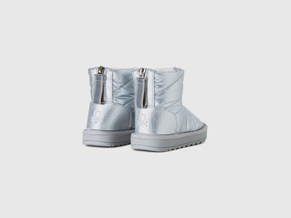 Back view of a pair of silver Nylon Ankle Boots, highlighting their robust construction and quilted details, suitable for outdoor wear in Kuwait.