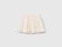 Front view of a white Benetton tulle skirt, featuring a full, ruffled silhouette. Lightweight and airy.