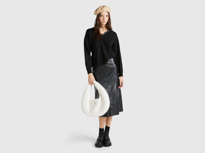 Full outfit of a woman wearing a black lace top, leather skirt, and beret.