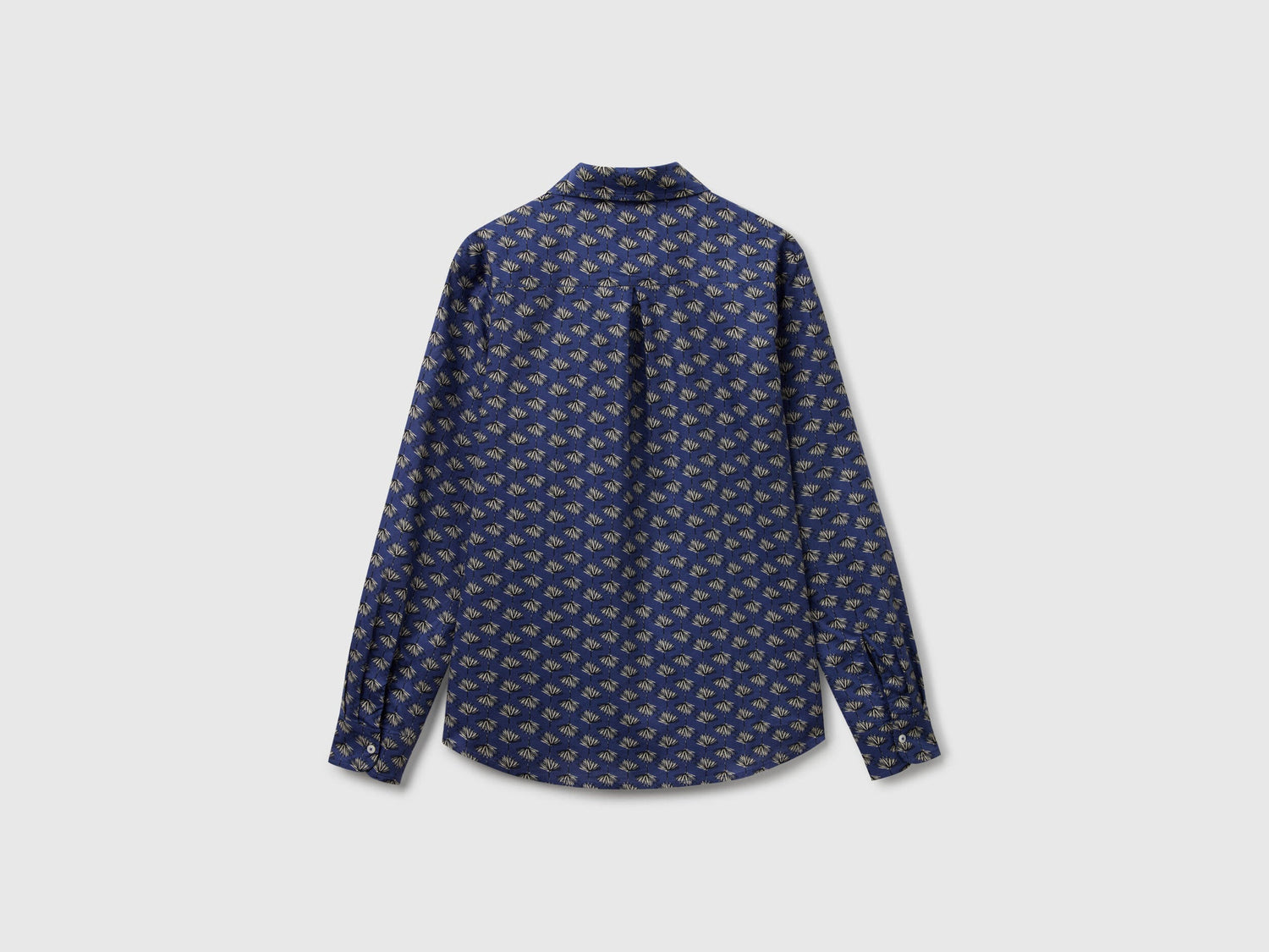 Flat back view of a dark blue patterned shirt for women, available online in Kuwait.