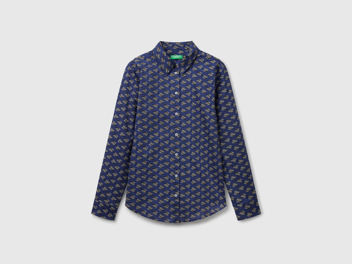 Flat front view of a dark blue patterned shirt for women, popular in Kuwait.