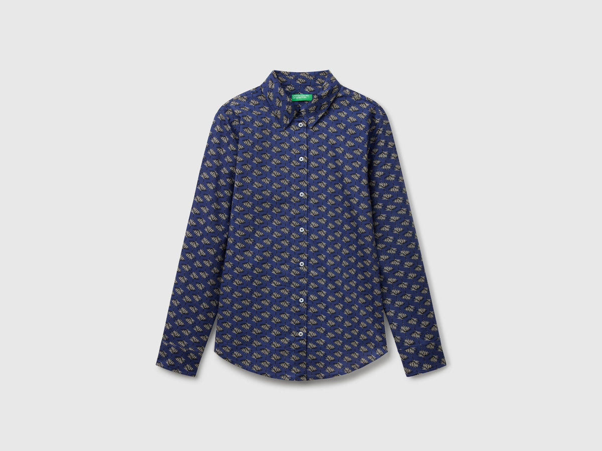 Flat front view of a dark blue patterned shirt for women, popular in Kuwait.