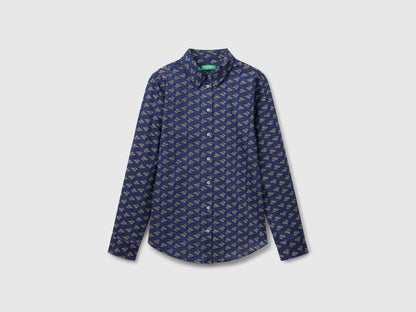 Flat front view of a dark blue patterned shirt for women, popular in Kuwait.