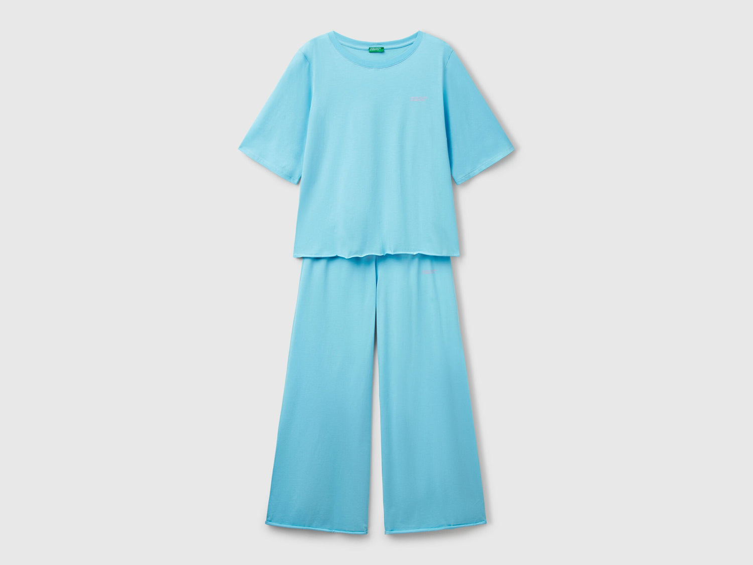 Flat lay front view of a light blue loose-fitting pyjama set for women.