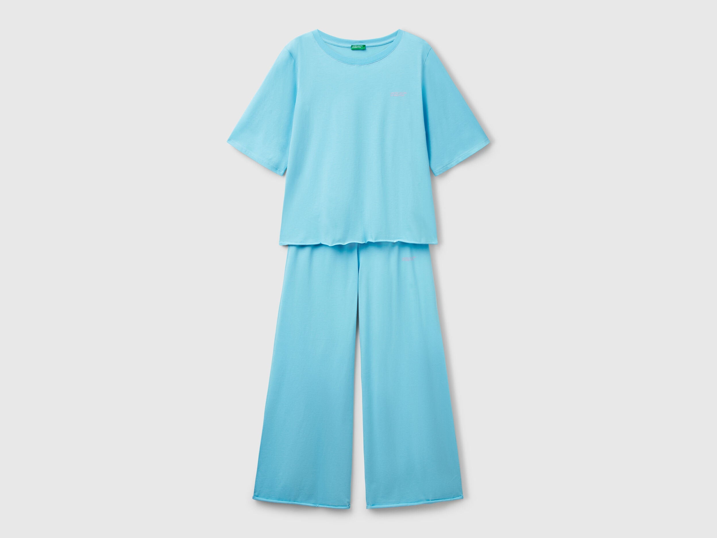 Flat lay front view of a light blue loose-fitting pyjama set for women.