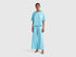 Front view of a woman wearing a light blue loose-fitting pyjama set.