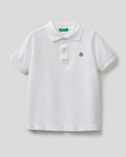 Front view of a white polo shirt for boys in Kuwait, with short sleeves.