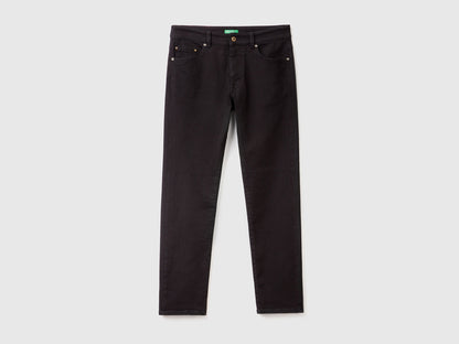 Close-up of the waistband, button, and pockets on a pair of men&