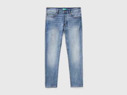 Flat lay back view of black slim-fit jeans for men.