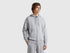 Front view of a man wearing a plain grey cotton zip-up hoodie.