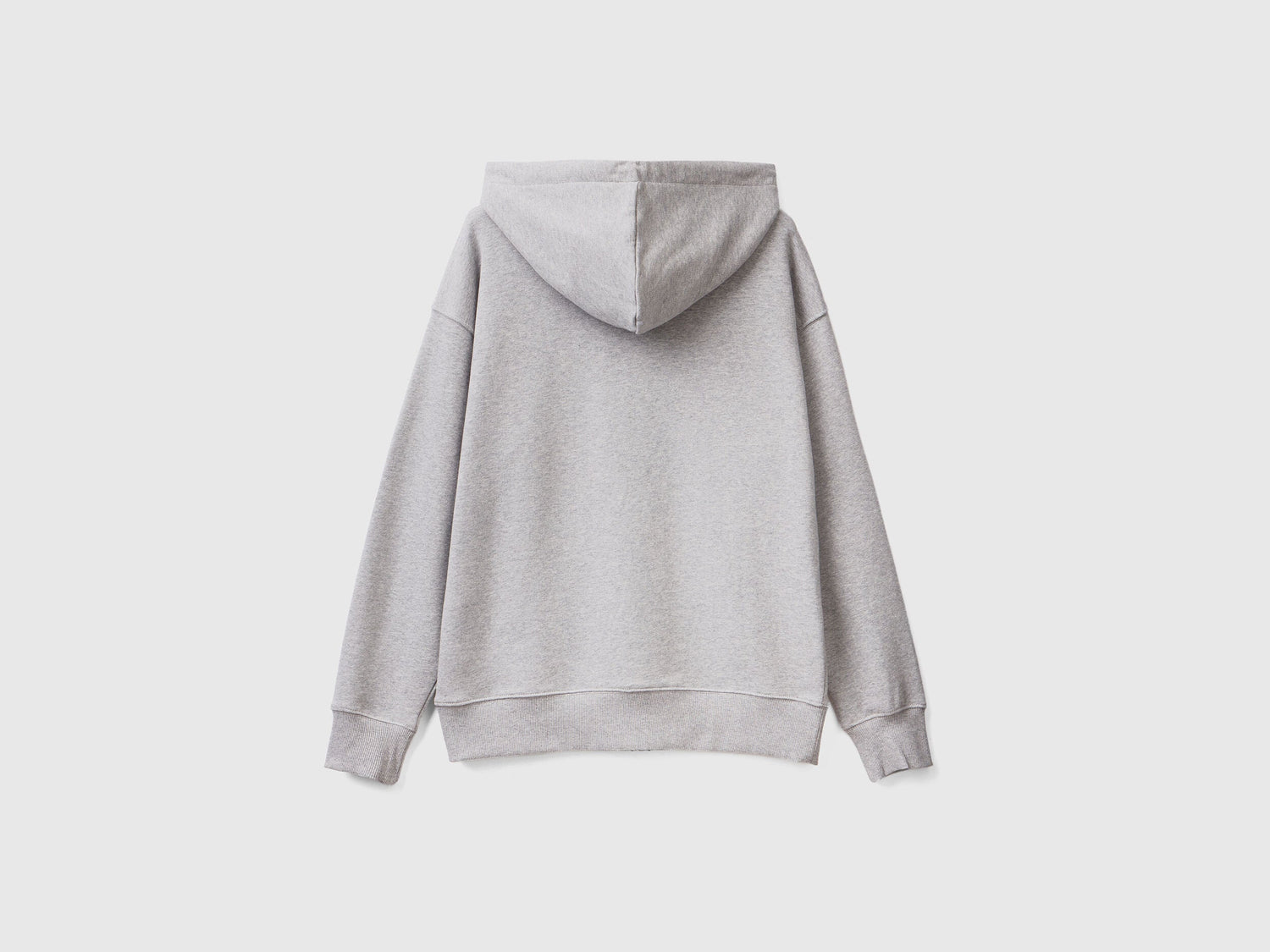 Close-up of the hood and drawstring on a grey cotton zip-up hoodie.