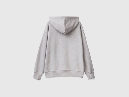 Close-up of the hood and drawstring on a grey cotton zip-up hoodie.