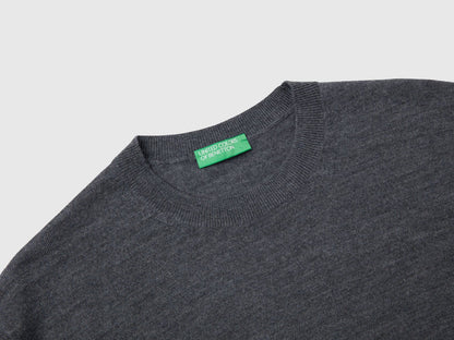 Close-up of the collar and texture of a grey merino wool sweater for men.