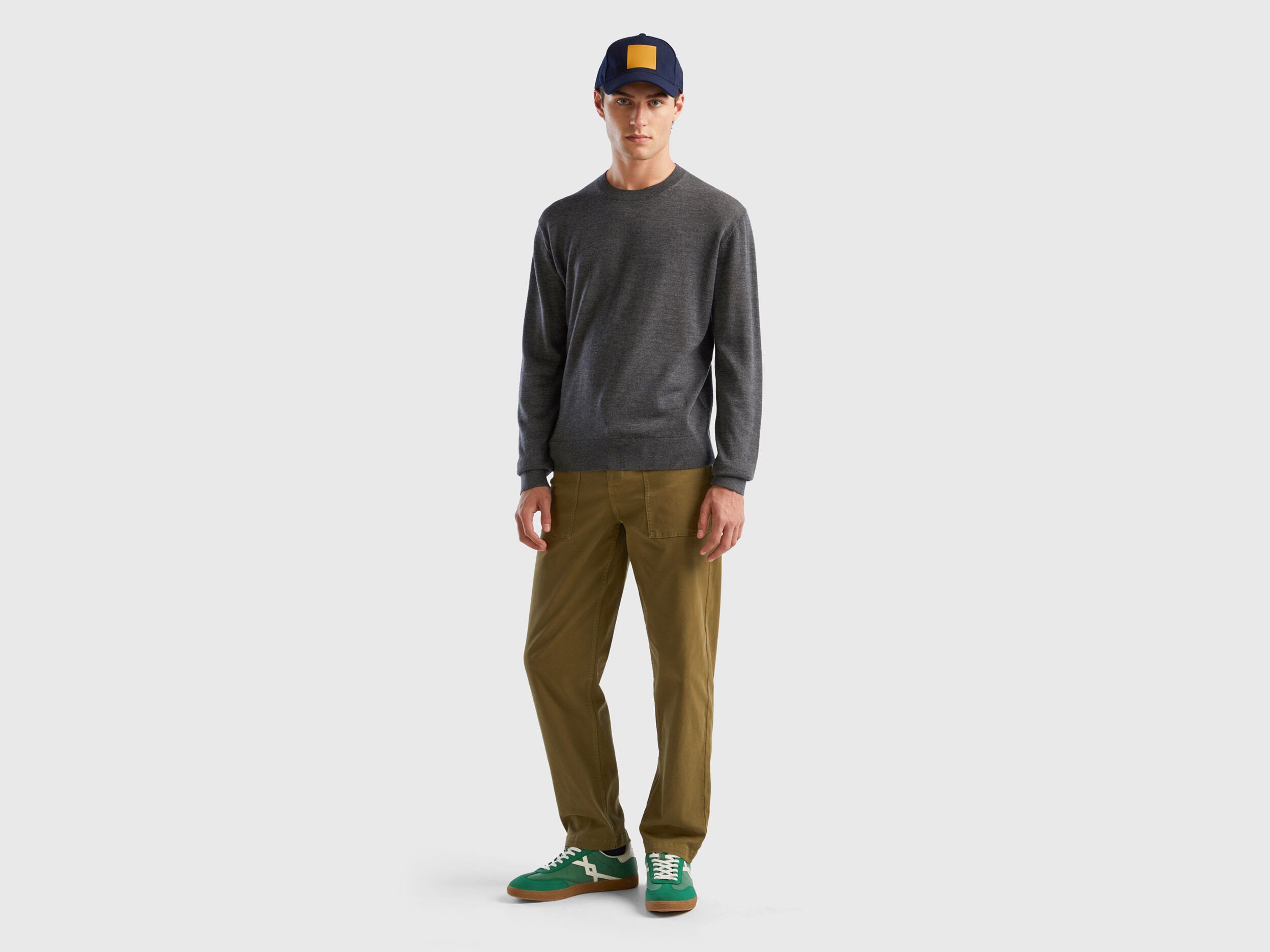 Flat lay front view of a grey merino wool sweater for men.