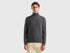 Front view of a man wearing a grey turtleneck sweater.

