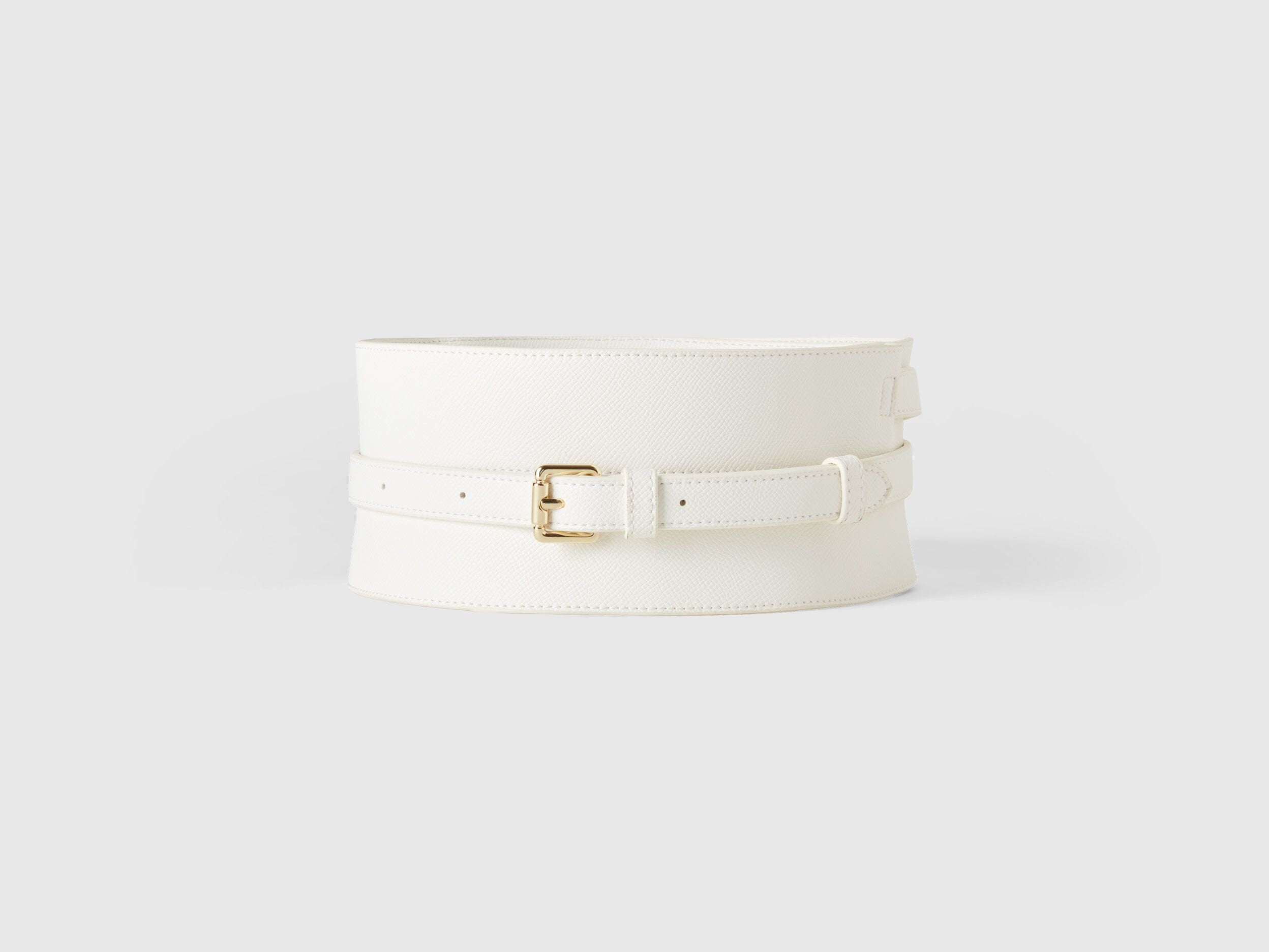 Front view of a wide white crocodile print corset belt with a gold buckle. Fashion accessory.