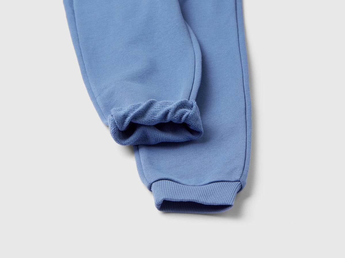 Back flat lay view of heather grey sweatpants for women in Kuwait, showing the comfortable fit and a small back pocket detail.