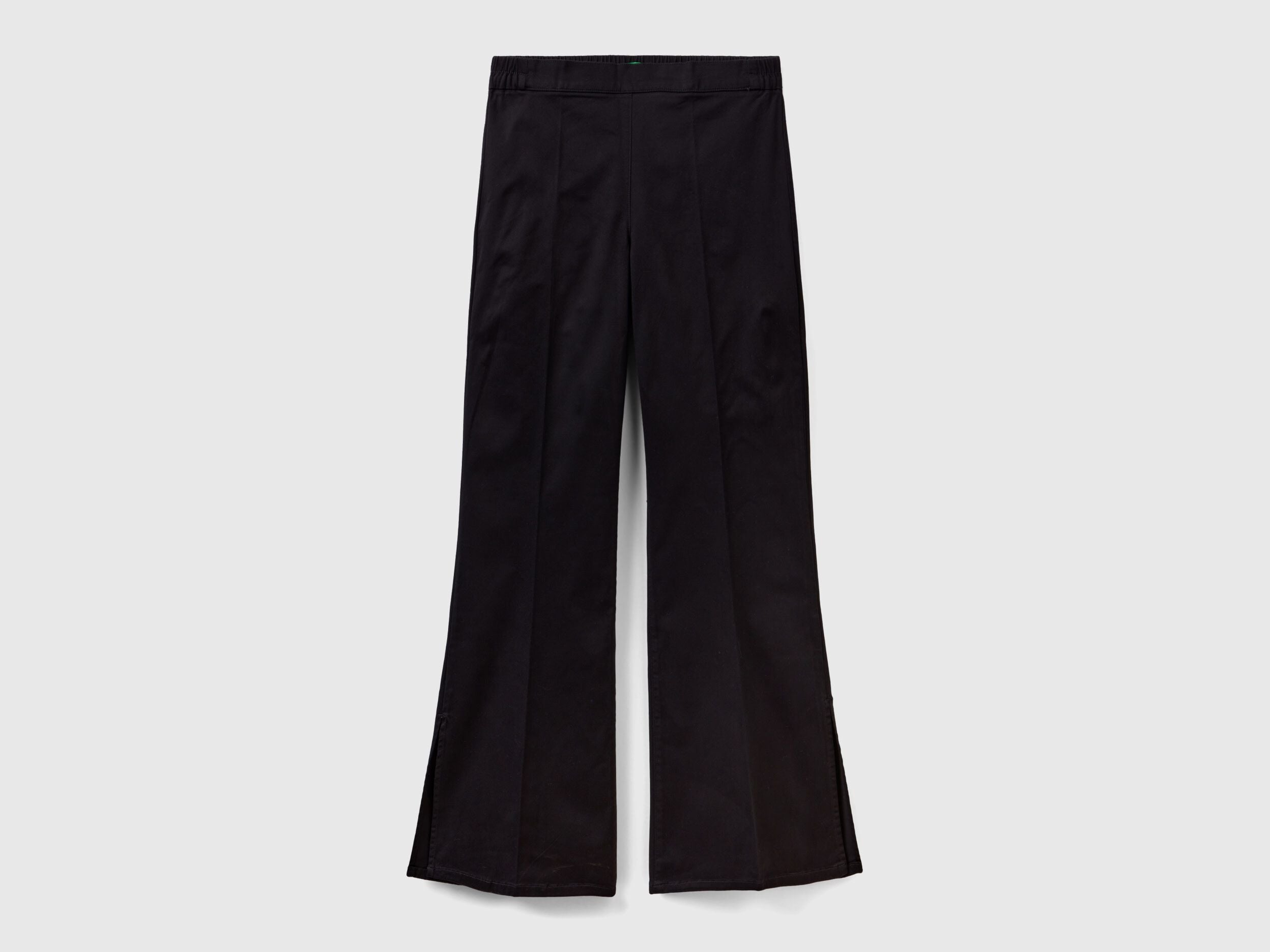 Flat lay front view of black flared pants for women.