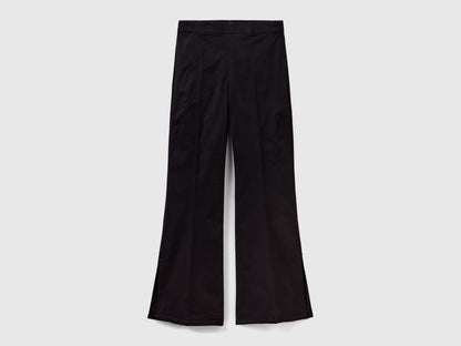 Flat lay front view of black flared pants for women.